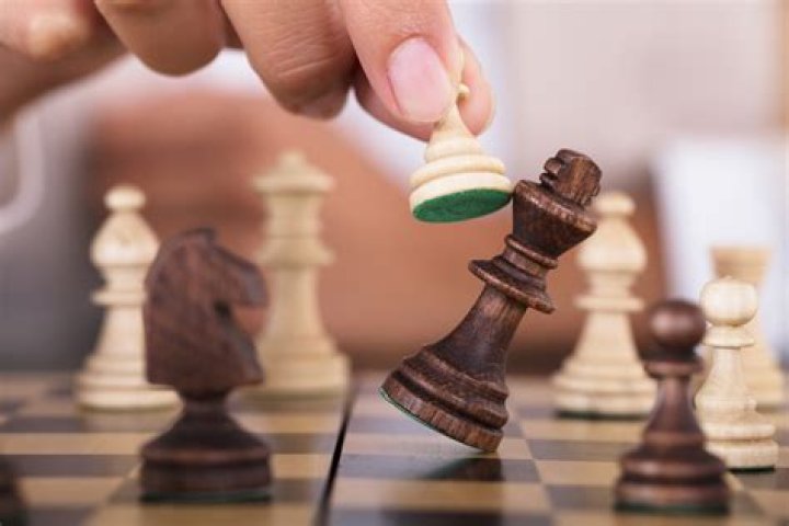 Can a king take a piece that has it in check?