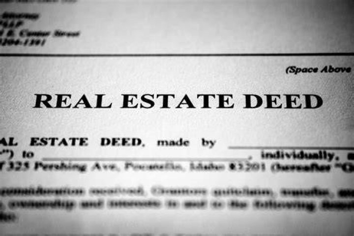 How do I change the name on the deeds to my house?