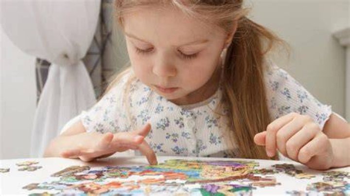 How do puzzles help social development?