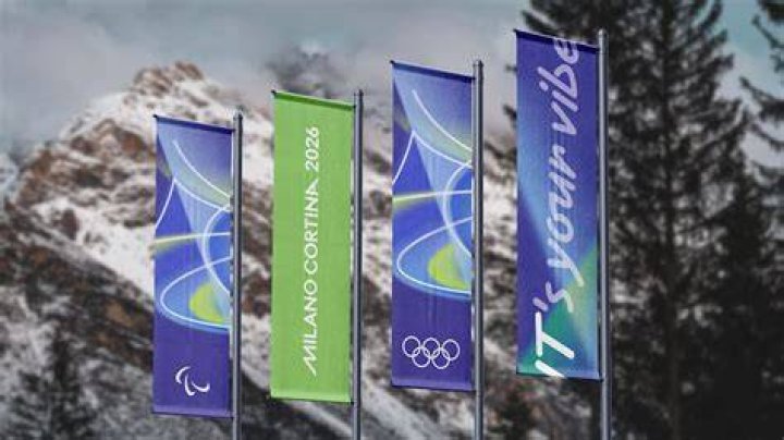 What was the official motto of 2006 Winter Olympics?