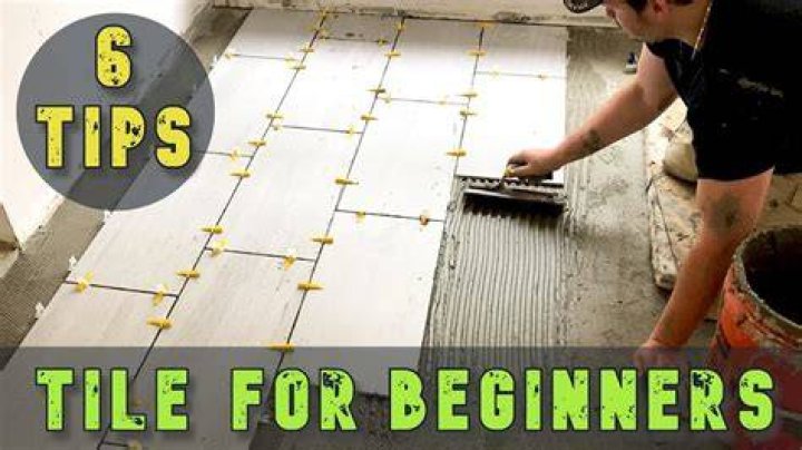 Where do you start when you laying floor tiles?