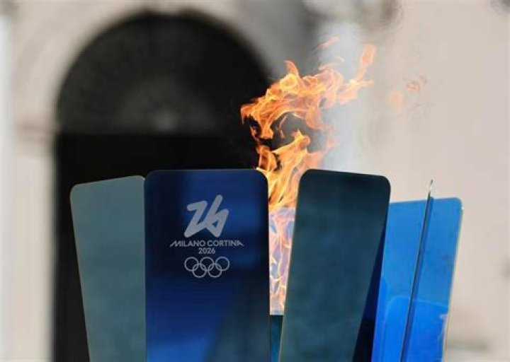 Who received the torch at the end of the 2014 Winter Olympics?