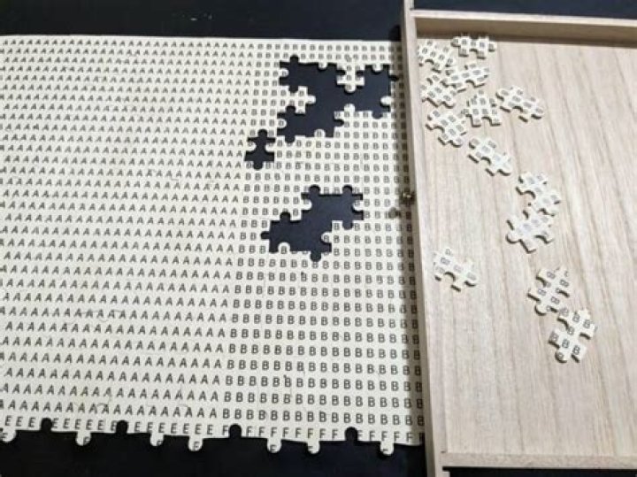 Why are there letters on back of puzzle pieces?