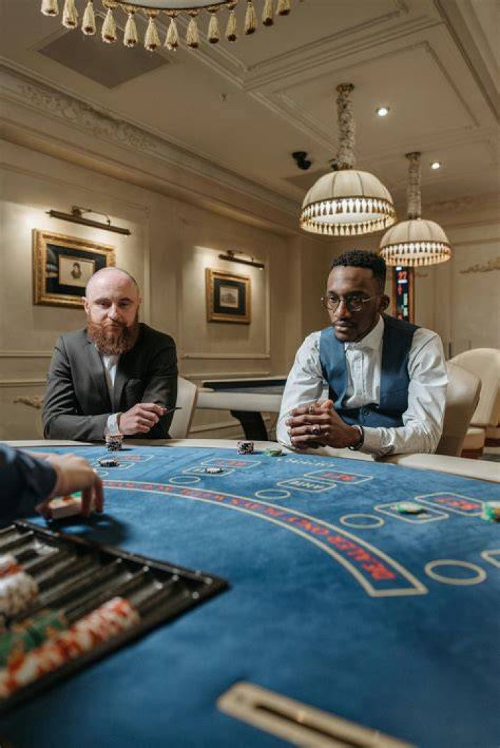Why do poker players wait to look at their cards?